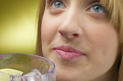 Portrait of woman drinking a cocktail
