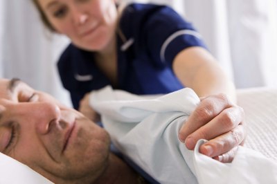 Nurse helping patient