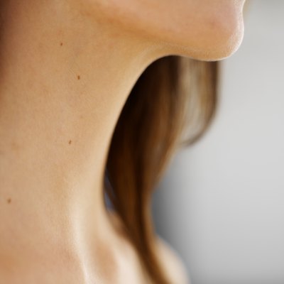 Close-up of woman's neck and throat