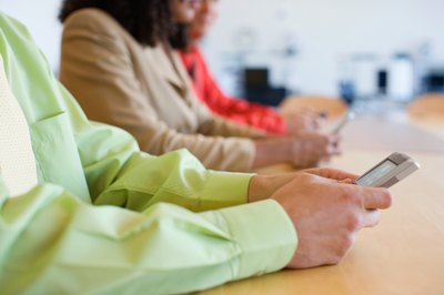 co-workers using handheld portable devices