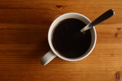 A cup of black coffee.