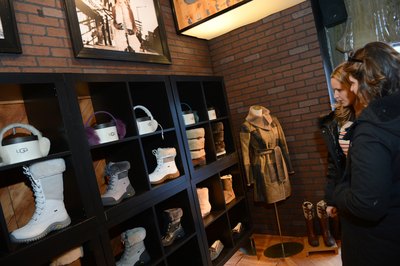 Women looking at Ugg shoe display