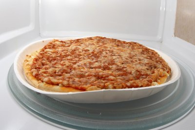 Frozen pizza in a microwave