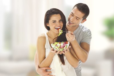 young hipsters eating salad