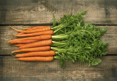 Carrots on wooden table