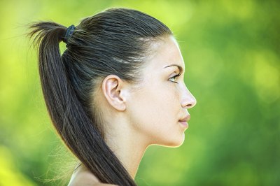 Long, heavy hair can cause headaches.