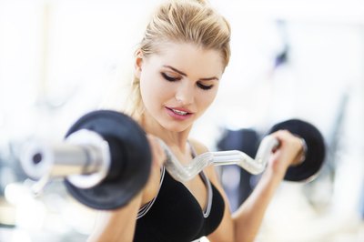 Woman strength training in gym