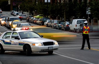 Police car driving down street