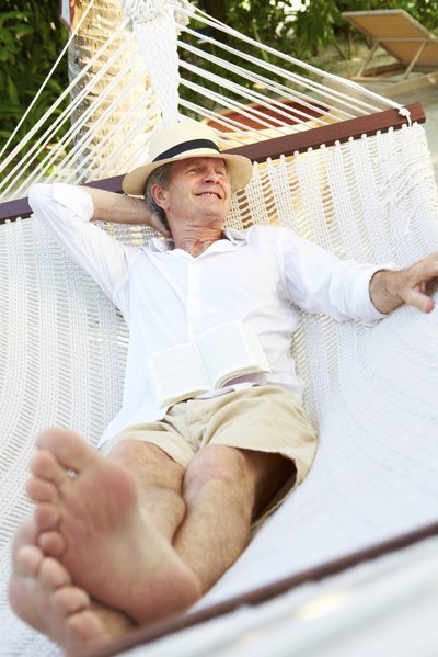Man wearing long sleeves and shorts in hammock