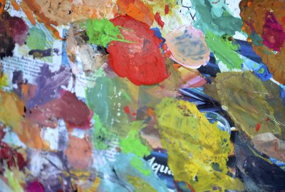 Splotches of oil paints on paper.