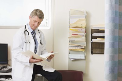 doctor looking at file