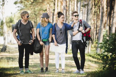 hipsters walking around in park