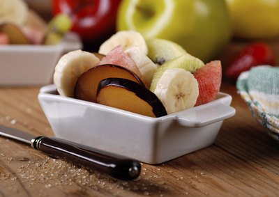 Raw fruits in a ceramic dish