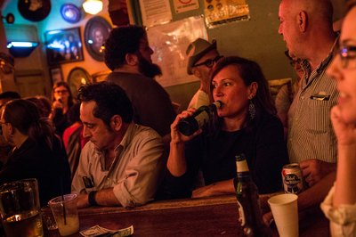 Patrons drink inside a bar in New York City