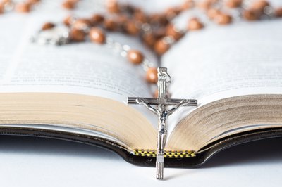 An open prayer book lies on a table.