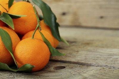 Mandarin oranges on a wooden deck