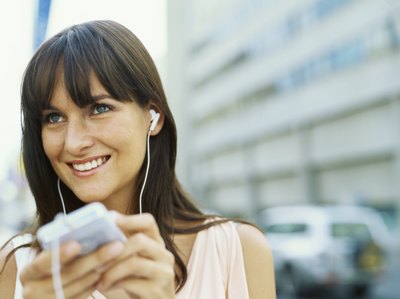 Woman listening to headphones