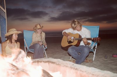 Teens around bonfire