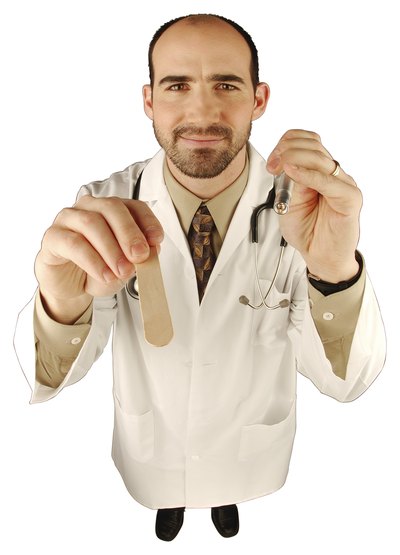 Doctor with tounge depressor and light