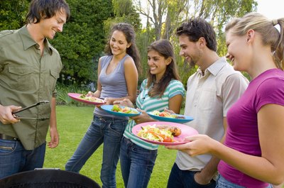 man barbequeing for guests