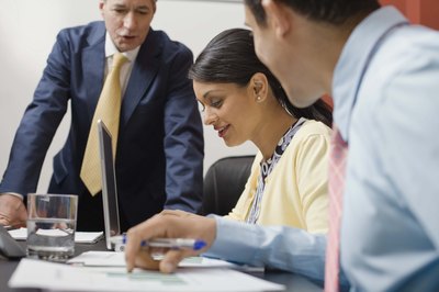 Colleagues talking in office