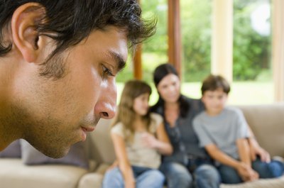 Man looking away from family