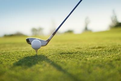 Golf club and ball on tee