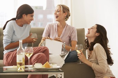Friends exchanging gifts at party