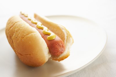 A high sodium hot dog on a plate.