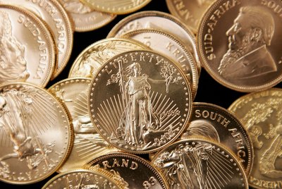 American Eagle gold coin with South African gold coins