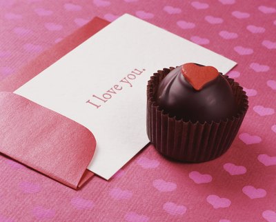 Valentine card beside cupcake