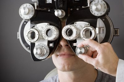 Eye doctor performing exam