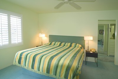 Light green painted bedroom