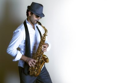 A jazz saxophonist wearing dark sunglasses.