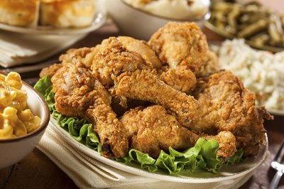 A serving plate full of fried chicken.