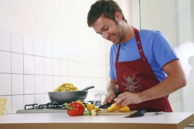 Man slicing peppers