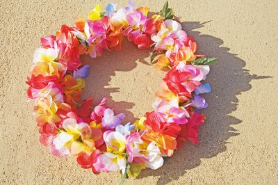A bright lei on the sand.
