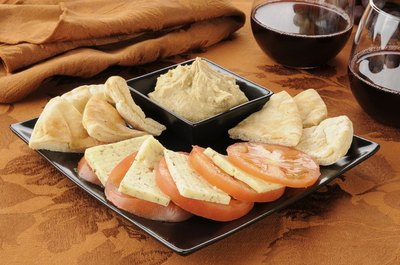 Tomatoes with dill cheese and hummus