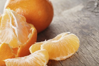 A close-up of a peeled mandarin orange.