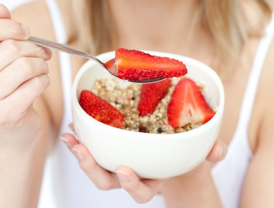 A 130 pound woman should aim to eat about 1630 calories per day.