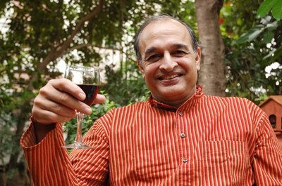 man holding wine glass