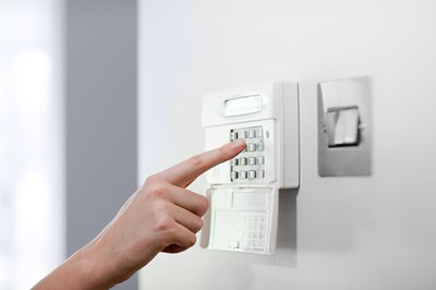 Close-up of woman setting alarm