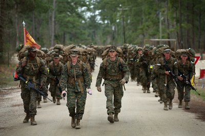 Marines carry 55 lb. packs during Military Training at Camp Lejeune