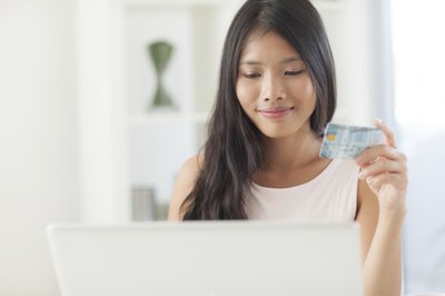 Image of a woman shopping on her computer.
