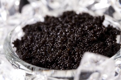 Black caviar in a bowl on ice