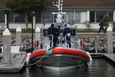 The U.S. Coast Guard inspects a boat.