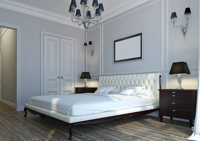 White or off-white bedroom walls are classic colors which will open up any room