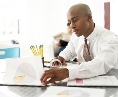 businessman studying reports