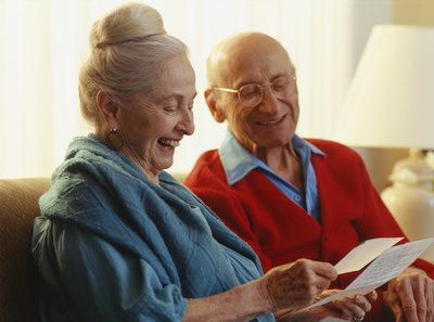 old couple reading an old travel letter