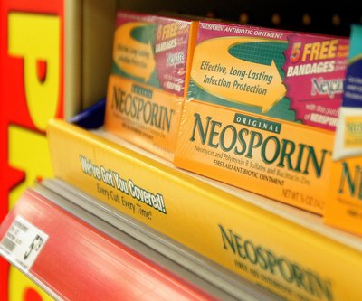 Neosporin can be applied to the wound area after it has been cleaned.
